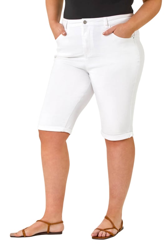 Curve Stretch Knee Length Denim Shorts from Roman. Give your Summer wardrobe a revamp with our new and improved knee length shorts. An essential for any ladies wardrobe, these long length Curve shorts have a comfortable stretch and a turned up hem for those warmer days. Secured to the front with a button and fly fastening, these denim favourites are finished with pocket detail to front and back. Make sure to pack yours in your holiday suitcase, team with your favourite printed or plain tees and sandals for a warm weather look.
