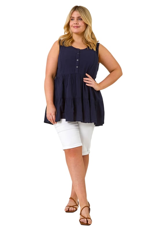 Curve Stretch Knee Length Denim Shorts from Roman. Give your Summer wardrobe a revamp with our new and improved knee length shorts. An essential for any ladies wardrobe, these long length Curve shorts have a comfortable stretch and a turned up hem for those warmer days. Secured to the front with a button and fly fastening, these denim favourites are finished with pocket detail to front and back. Make sure to pack yours in your holiday suitcase, team with your favourite printed or plain tees and sandals for a warm weather look.