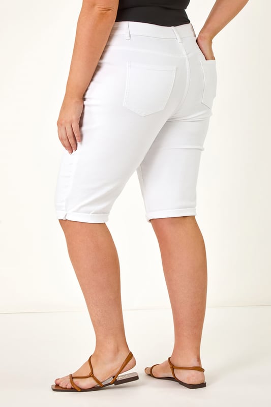 Curve Stretch Knee Length Denim Shorts from Roman. Give your Summer wardrobe a revamp with our new and improved knee length shorts. An essential for any ladies wardrobe, these long length Curve shorts have a comfortable stretch and a turned up hem for those warmer days. Secured to the front with a button and fly fastening, these denim favourites are finished with pocket detail to front and back. Make sure to pack yours in your holiday suitcase, team with your favourite printed or plain tees and sandals for a warm weather look.