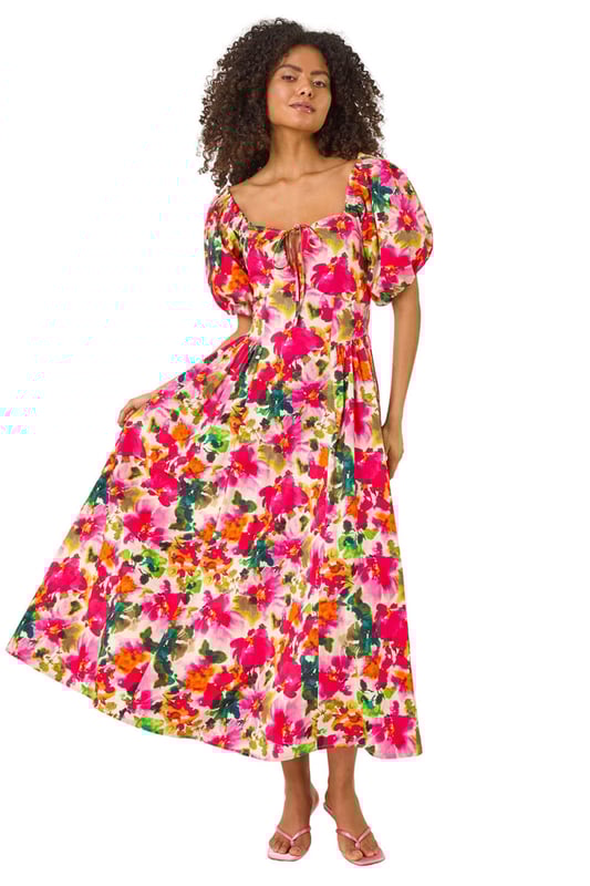 Dusk Floral Pleated Puff Dress from Roman. Feel chic and feminine in this floral puff dress, perfect for the Spring/Summer season. Featuring a flattering tie detail at the bust and cute short puff sleeves, this dress is designed in a stylish fit. Made from a comfortable woven fabric, it's a pull-on style for effortless wearing. Pair with sandals and sunglasses for a delightful outfit that's ideal for sunny days out!