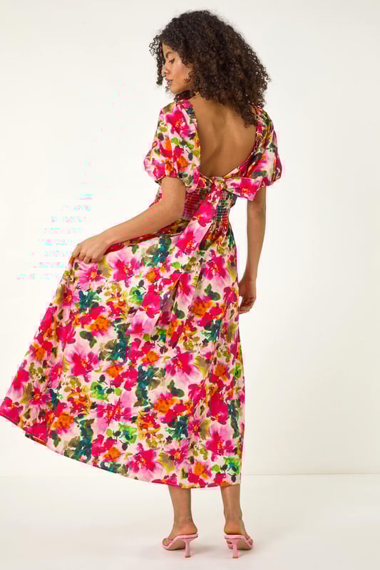 Dusk Floral Pleated Puff Dress from Roman. Feel chic and feminine in this floral puff dress, perfect for the Spring/Summer season. Featuring a flattering tie detail at the bust and cute short puff sleeves, this dress is designed in a stylish fit. Made from a comfortable woven fabric, it's a pull-on style for effortless wearing. Pair with sandals and sunglasses for a delightful outfit that's ideal for sunny days out!
