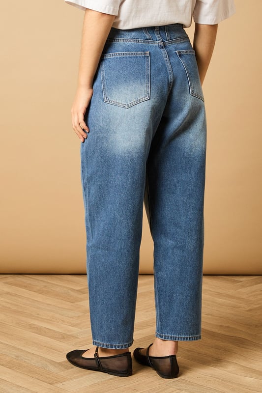 Trendy barrel leg silhouette for a modern twist on classic denim
        High-rise waist for a flattering and comfortable fit
        Tapered design from thigh to ankle for a stylish shape
        Traditional five-pocket styling for practicality
        Button and zip fly fastening for secure wear
    
    Embrace the latest denim trend with these chic barrel leg jeans from Oasis. The high-rise waist and tapered silhouette create a flattering shape that's perfect for various body types. Style these versatile jeans for a range of casual occasions - pair them with a cropped white tee and denim jacket for a double denim look that's effortlessly cool. For a more polished ensemble, team with a silky blouse and metallic flats. These jeans are ideal for family gatherings, weekend brunches, or casual Fridays at the office. The relaxed fit through the thigh transitioning to a slightly narrower ankle offers both comfort and style, making these jeans a wardrobe staple that you'll reach for time and time again.