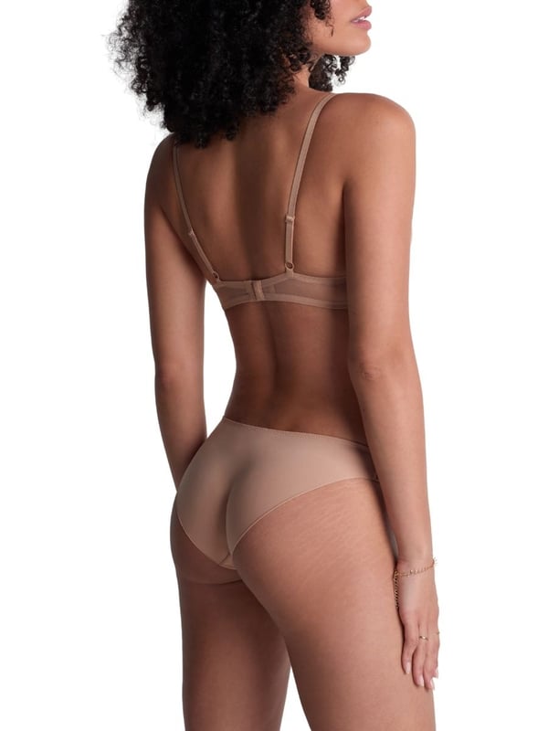 Aubade Sheer Emotion Moulded Push-Up Bra. Underwired plunge bra bra with lightweight moulded cleavage enhancing cups, shimmering fabric, a comfortable semi sheer mesh back, and intricate embroidery. Matching briefs available. This item is recommended for hand wash only.