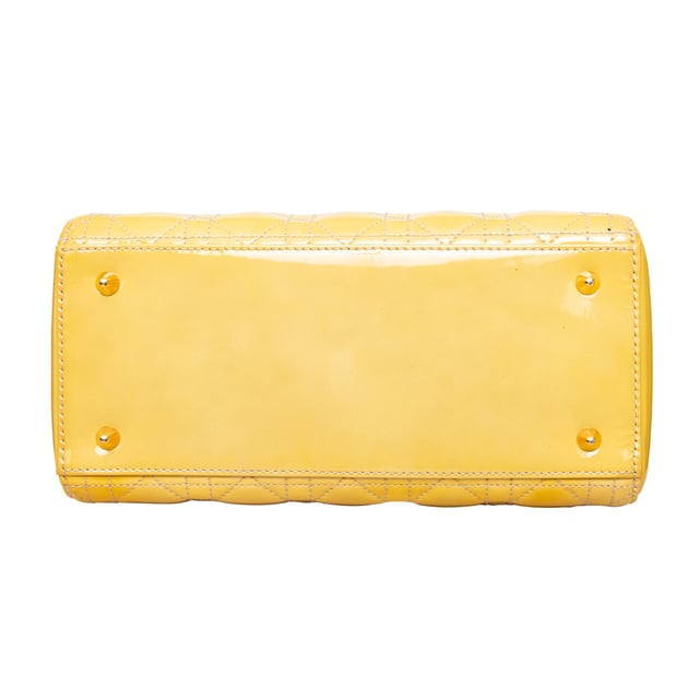 VINTAGE, RRP AS NEW
Crafted in yellow lambskin with Dior's iconic 'Cannage' stitching, this bag features leather top handles, an optional shoulder strap, and silver-toned hardware.
Inclusion: Dust bag.
Remarks: There are some spots on the leather. Measurments:  width: 584 mm height: 482 mm handle drop: 241.3 mm