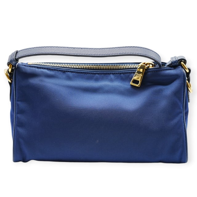 VINTAGE, RRP AS NEW
The Prada Blue Nylon Shoulder Bag features a minimalist design in vibrant blue nylon. Lightweight and functional, it’s perfect for adding a pop of color and modern style to everyday ensembles.
Inclusion: Dustbag, instruction paper
Remarks: Overall no damages 
Assured Product Authenticity: This product is supplied by a renowned and trusted partner.
With this purchase, you are preserving iconic craftsmanship, celebrating heritage, and embracing the beauty of conscious shopping.Measurments:  width: 152 mm length: 584 mm height: 342 mm
