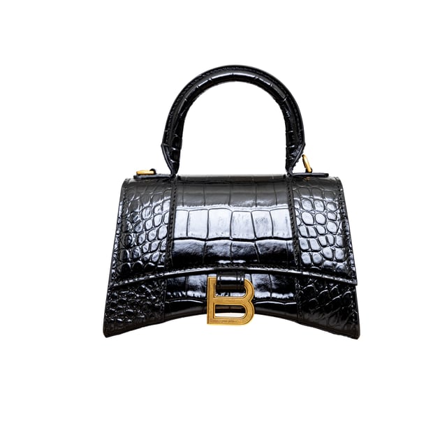 VINTAGE, RRP AS NEW
Crafted from black, shiny crocodile embossed calfskin, this Balenciaga handbag in XS format features the iconic curvilinear base, one top handle, and a studded magnet closure for a chic and modern touch. The aged-gold B logo hardware and nappa lambskin lining add a touch of sophistication, while the back and inner pockets and the removable shoulder strap make the bag more functional.
Inclusion: dust bag, shoulder strap.
NFT option available. Discover more.
Assured Product Authenticity: This product is supplied by a renowned and trusted partner.
With this purchase, you are preserving iconic craftsmanship, celebrating heritage, and embracing the beauty of conscious shopping.Measurments:  width: 165 mm length: 457 mm height: 300 mm handle drop: 165 mm