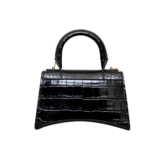 VINTAGE, RRP AS NEW
Crafted from black, shiny crocodile embossed calfskin, this Balenciaga handbag in XS format features the iconic curvilinear base, one top handle, and a studded magnet closure for a chic and modern touch. The aged-gold B logo hardware and nappa lambskin lining add a touch of sophistication, while the back and inner pockets and the removable shoulder strap make the bag more functional.
Inclusion: dust bag, shoulder strap.
NFT option available. Discover more.
Assured Product Authenticity: This product is supplied by a renowned and trusted partner.
With this purchase, you are preserving iconic craftsmanship, celebrating heritage, and embracing the beauty of conscious shopping.Measurments:  width: 165 mm length: 457 mm height: 300 mm handle drop: 165 mm