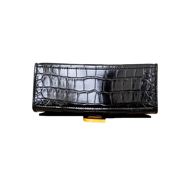 VINTAGE, RRP AS NEW
Crafted from black, shiny crocodile embossed calfskin, this Balenciaga handbag in XS format features the iconic curvilinear base, one top handle, and a studded magnet closure for a chic and modern touch. The aged-gold B logo hardware and nappa lambskin lining add a touch of sophistication, while the back and inner pockets and the removable shoulder strap make the bag more functional.
Inclusion: dust bag, shoulder strap.
NFT option available. Discover more.
Assured Product Authenticity: This product is supplied by a renowned and trusted partner.
With this purchase, you are preserving iconic craftsmanship, celebrating heritage, and embracing the beauty of conscious shopping.Measurments:  width: 165 mm length: 457 mm height: 300 mm handle drop: 165 mm