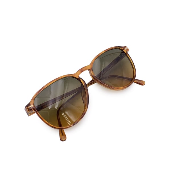 VINTAGE, RRP AS NEW
Infuse your look with vintage allure through these stunning Christian Dior CD 2614 sunglasses, a rare find from the fashion-forward 1980s. With their graceful classic and simple silhouette and warm brown tones, they embody the elegance and flair that defined Dior's golden age of accessories.  Made in Germany for women, this model is crafted from high-quality Lcm Optyl, offering both durability and a lightweight, comfortable fit. The 54 mm wide lenses and 42 mm height provide flattering coverage, while the 140 mm temples and temple-to-temple width create a balanced, secure wear perfect for everyday style or standout vintage looks.  Graded in A - EXCELLENT Condition Rating: A - EXCELLENTCondition Details: Gently Used. Lenses and frame in excellent condition. Please check the images carefully. Some show arrows indicating any evident defect. Please ask if you need to know more details or if you have any doubts. Generic case always included, please ask for availability of original case. Glasses maximum Width: 140mm Glasses Temple 130mm Glasses maximum lens width: 54mm Glasses maximum lens 42mm Glasses bridge width: 15mm Measurments:  width: 140 mm height: 42 mm