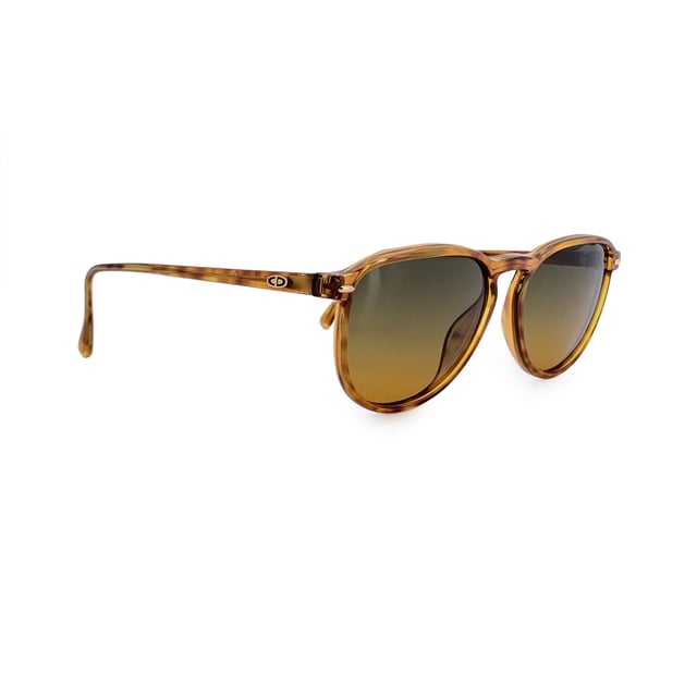 VINTAGE, RRP AS NEW
Infuse your look with vintage allure through these stunning Christian Dior CD 2614 sunglasses, a rare find from the fashion-forward 1980s. With their graceful classic and simple silhouette and warm brown tones, they embody the elegance and flair that defined Dior's golden age of accessories.  Made in Germany for women, this model is crafted from high-quality Lcm Optyl, offering both durability and a lightweight, comfortable fit. The 54 mm wide lenses and 42 mm height provide flattering coverage, while the 140 mm temples and temple-to-temple width create a balanced, secure wear perfect for everyday style or standout vintage looks.  Graded in A - EXCELLENT Condition Rating: A - EXCELLENTCondition Details: Gently Used. Lenses and frame in excellent condition. Please check the images carefully. Some show arrows indicating any evident defect. Please ask if you need to know more details or if you have any doubts. Generic case always included, please ask for availability of original case. Glasses maximum Width: 140mm Glasses Temple 130mm Glasses maximum lens width: 54mm Glasses maximum lens 42mm Glasses bridge width: 15mm Measurments:  width: 140 mm height: 42 mm