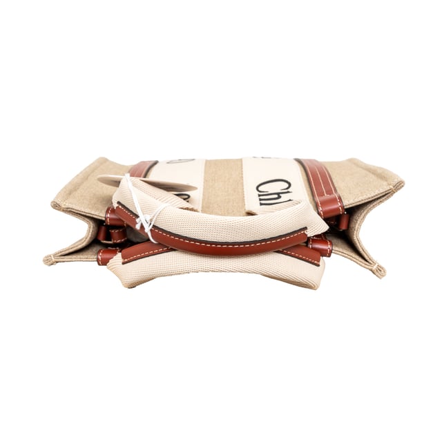 VINTAGE, RRP AS NEW
Effortlessly chic and environmentally conscious, the small Chloé Woody Tote Bag is crafted from lower-impact linen canvas and shiny brown calfskin strips. This compact bag features a roomy unlined interior with a practical leather shoulder strap and can be carried by top handles or as a crossbody on the shoulder.
Inclusion: dust bag, shoulder strap, authenticity card.
Assured Product Authenticity: This product is supplied by a renowned and trusted partner.
With this purchase, you are preserving iconic craftsmanship, celebrating heritage, and embracing the beauty of conscious shopping.Measurments:  width: 80 mm length: 260 mm height: 200 mm handle drop: 100 mm