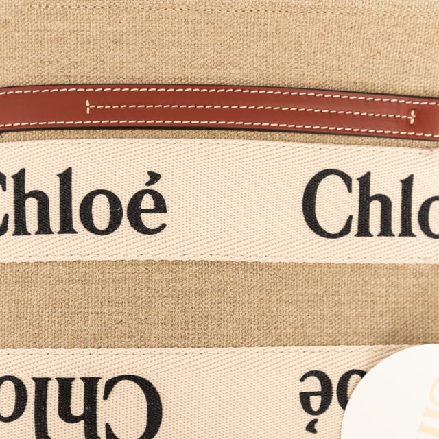 VINTAGE, RRP AS NEW
Effortlessly chic and environmentally conscious, the small Chloé Woody Tote Bag is crafted from lower-impact linen canvas and shiny brown calfskin strips. This compact bag features a roomy unlined interior with a practical leather shoulder strap and can be carried by top handles or as a crossbody on the shoulder.
Inclusion: dust bag, shoulder strap, authenticity card.
Assured Product Authenticity: This product is supplied by a renowned and trusted partner.
With this purchase, you are preserving iconic craftsmanship, celebrating heritage, and embracing the beauty of conscious shopping.Measurments:  width: 80 mm length: 260 mm height: 200 mm handle drop: 100 mm