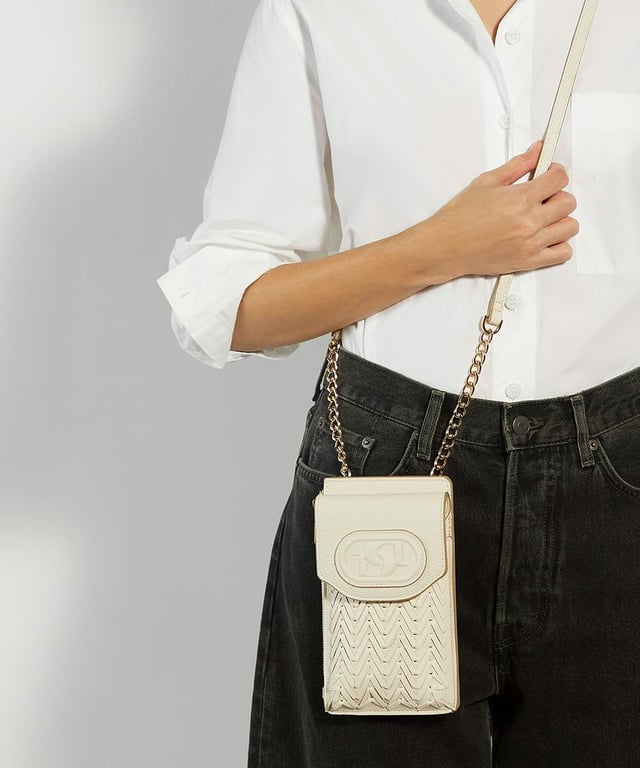 Fitted with a front compartment to slip your smartphone into and an extra side zipped pocket for your keys and a back pocket for your cards, this slimline pouch is suspended from a part chain detail cross-body strap. The front features our embossed logo.
