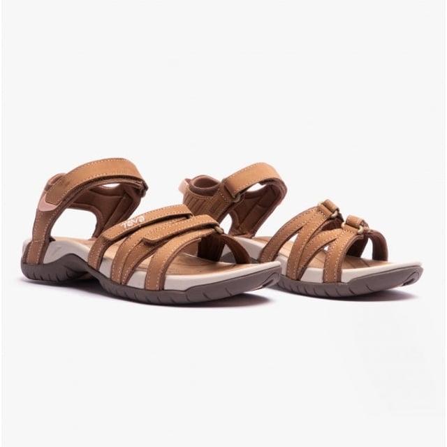 These lightweight, breathable leather sandals feature a cross-strap design with an adjustable touch fasten, a round toe, and a flat heel, ideal for casual wear