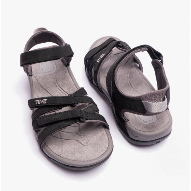 These women's strappy sandals feature a leather upper, textile lining, and rubber sole with adjustable touch fasten for comfort and breathability, ideal for casual wear