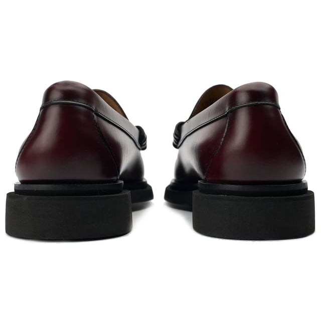 Change up your footwear game with the Step Larson Penny Loafer from G.H.Bass, a black leather treasure handcrafted exclusively with G.H.Bass's traditional hand-sewing techniques. The shoes are defined by innovative step welt detailing that merges the sole with the upper, giving the loafers a new elevated profile. A new sophisticated design with a literal modern edge provides added grip, durability, comfort, and style.