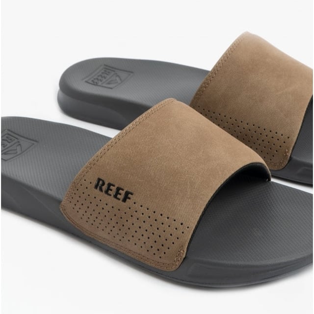 These men's slip-on sliders feature faux leather uppers, breathable synthetic lining, and rubber soles for comfort and durability, ideal for casual wear