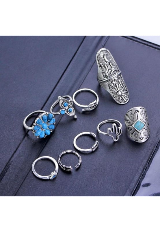 Piezas: 9  
pieza  
Material: Aleación de Turquesa  
Instrucciones de cuidado: Evite usar durante el ejercicio, ya que el sudor reaccionará con la joyería para producir cloruro de plata y sulfuro de cobre, lo que causa que la joyería se deteriore y corra con el tiempo.  
Importado  
Medidas del producto: Talla Única: Circunferencia 2.1  
2.4 in