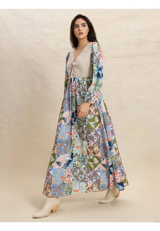 Tied Front Printed Long Sleeve Maxi Dress
  Material composition: 95% polyester 5% elastane
  No stretch
  Not lined
  Machine wash cold tumble dry low
  Imported
  Available in sizes S M L XL
  Length: S
  56.7 inches M
  57.1 inches L
  57.7 inches XL
  58.3 inches
  Shoulder: S
  15 inches M
  15.4 inches L
  15.9 inches XL
  16.5 inches
  Bust: S
  35.4 inches M
  37 inches L
  39.4 inches XL
  41.7 inches
  Waist: S
  27.6 inches M
  29.1 inches L
  31.5 inches XL
  33.9 inches
  Sleeve Length: S
  24 inches M
  24.4 inches L
  24.8 inches XL
  25.2 inches