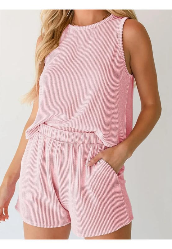 Round Neck Sleeveless Top and Shorts Set
  Features drawstring waist and ruffled detailing
  Two
  piece set includes sleeveless top and matching shorts
  Slightly stretchy fabric for comfort
  Material composition: 97% polyester 3% elastane
  Care instructions: Machine wash cold tumble dry low
  Imported
