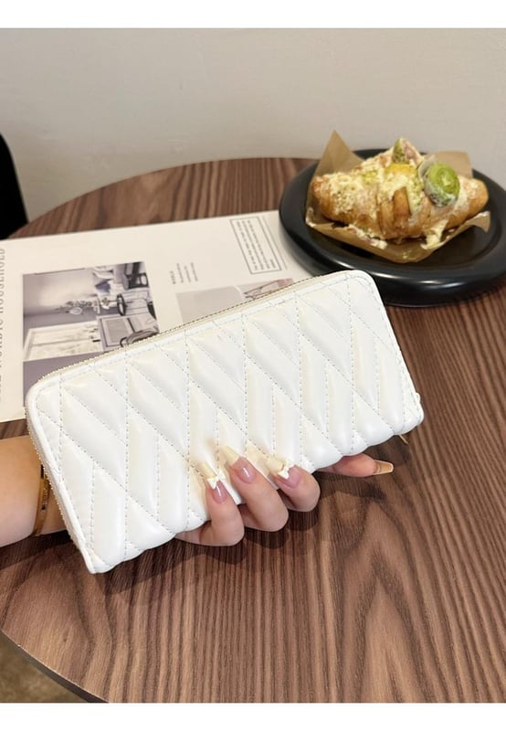 Bag size: Small
  Material: PU leather
  Imported
  Product Measurements (inches):
  Width: 3.9
  Height: 1.2
  Length: 7.7