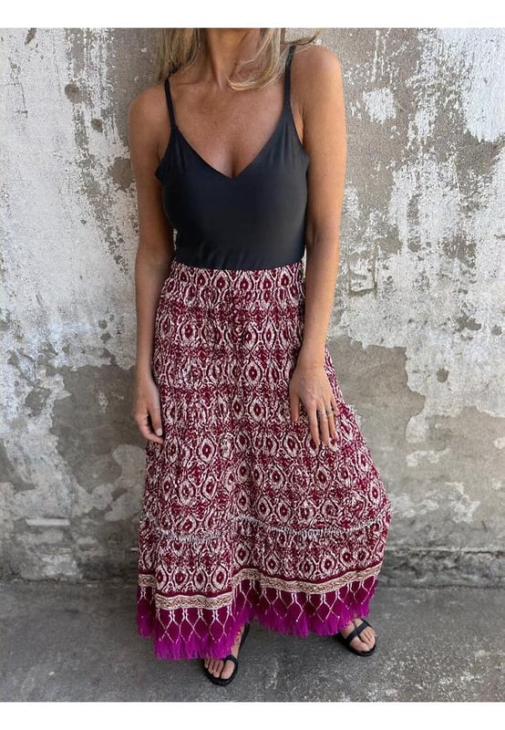 Ruffled design
  Opaque sheer finish
  100% polyester
  Machine wash cold
  Tumble dry low
  Imported
  Available in sizes S to XL
  Size S: Length 34.6 inches Waist 25.2 inches
  Size M: Length 35 inches Waist 26.8 inches
  Size L: Length 35.4 inches Waist 29.1 inches
  Size XL: Length 35.8 inches Waist 31.5 inches
Material: Rayon