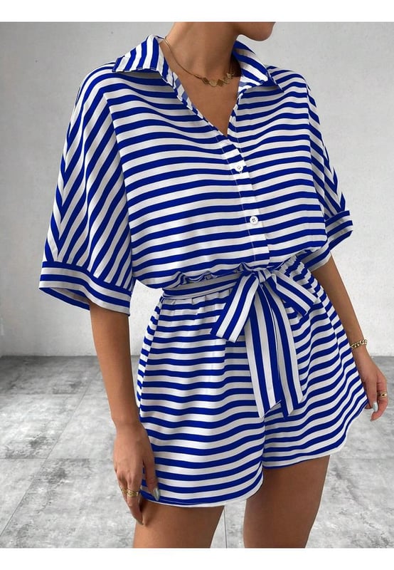 Buttoned front
  Tied waist
  Opaque fabric
  Material composition: 95% polyester 5% elastane
  Care instructions: Machine wash cold tumble dry low
  Imported