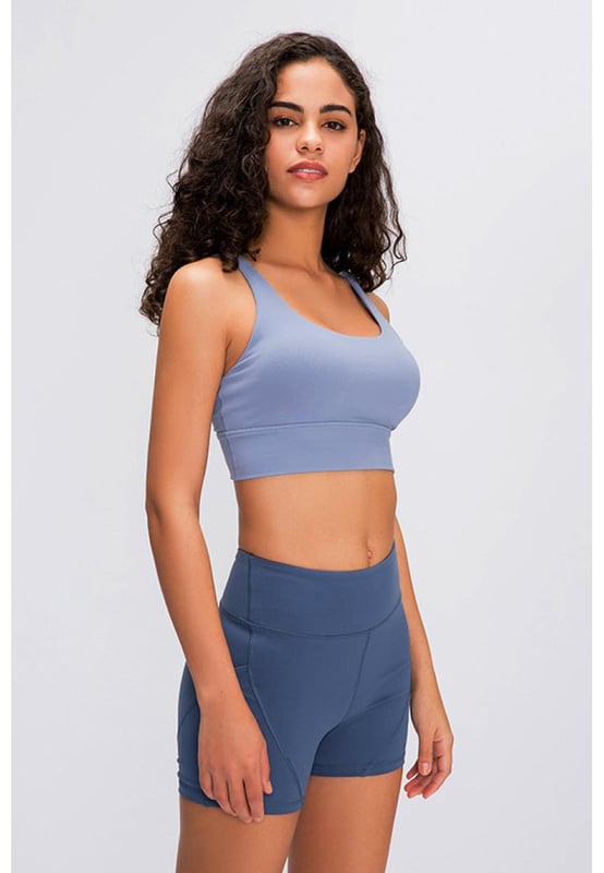 True to size
  Double
  X strappy back
  Supportive
  Material: 87% nylon 13% spandex
  Care: Machine wash cold. Do not tumble dry
  Imported
  S: length 12 in bust 26 in
  M: length 13 in bust 27 in
  L: length 13 in bust 29 in
  XL: length 13 in bust 30 in