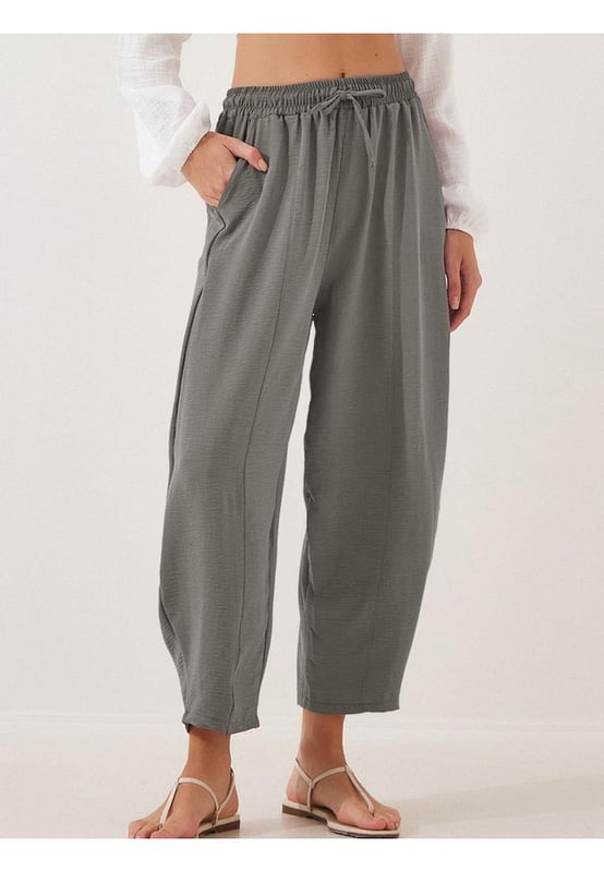 Full Size Drawstring Cropped Jogger Pants Plus Size
  Pocketed
  Sheer: Opaque
  Material composition: 95% polyester 5% spandex
  Care instructions: Machine wash cold. Tumble dry low.
  Imported