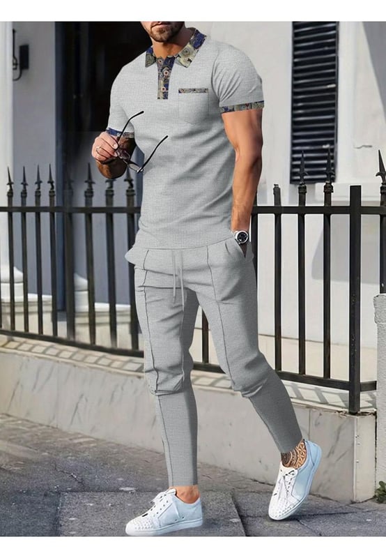 Basic style with buttoned details
  Includes pockets for added convenience
  Two
  piece set: short sleeve polo and pants
  Slightly stretchy material for comfort
  Made from 100% polyester
  Drawstring waist on pants for an adjustable fit
  Care instructions: Machine wash cold tumble dry low
  Imported