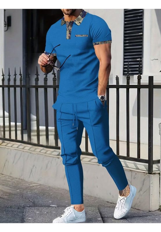 Basic style with buttoned details
  Includes pockets for added convenience
  Two
  piece set: short sleeve polo and pants
  Slightly stretchy material for comfort
  Made from 100% polyester
  Drawstring waist on pants for an adjustable fit
  Care instructions: Machine wash cold tumble dry low
  Imported
