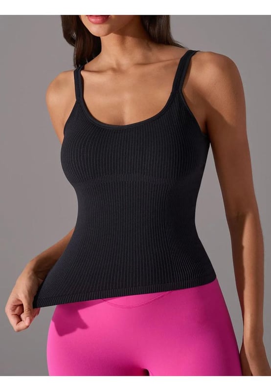 Basic style tank top
  Moderate stretch for comfort
  69% nylon 21% polyester 10% spandex
  Machine wash cold tumble dry low
  Imported
  Detachable chest pads for customizable support
  Available in sizes 4 to 12
Material: Ribbed fabric