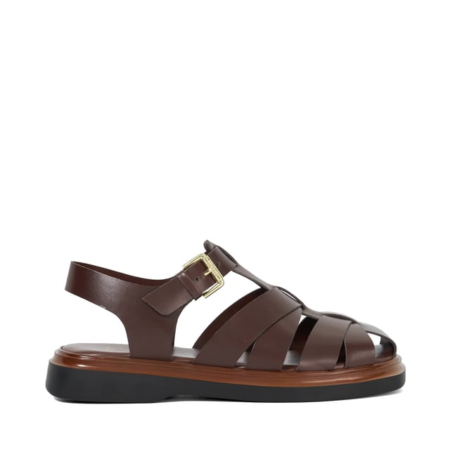 Lisherman redefines the classic beach sandal with its bold, contemporary design. Featuring a closed toe, adjustable ankle strap and a slight flatform sole for added lift, this chunky shoe combines style and comfort for a modern twist on a timeless classic.