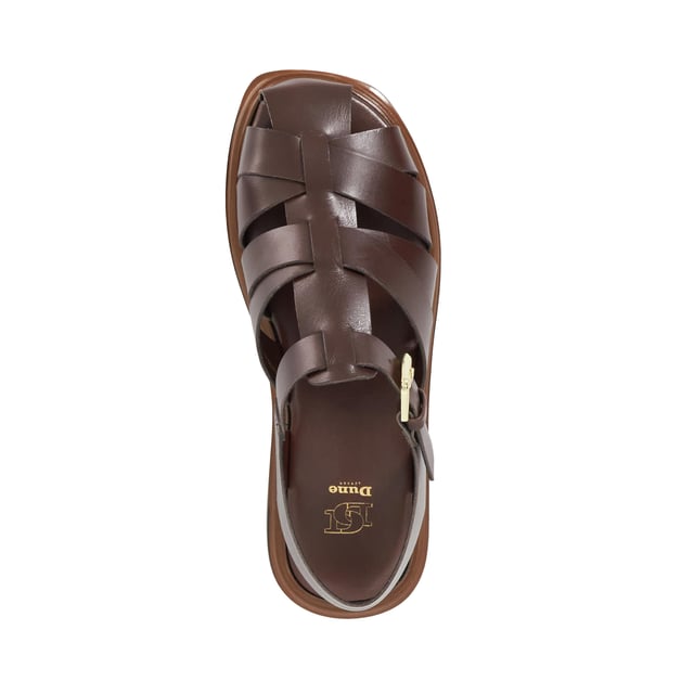 Lisherman redefines the classic beach sandal with its bold, contemporary design. Featuring a closed toe, adjustable ankle strap and a slight flatform sole for added lift, this chunky shoe combines style and comfort for a modern twist on a timeless classic.