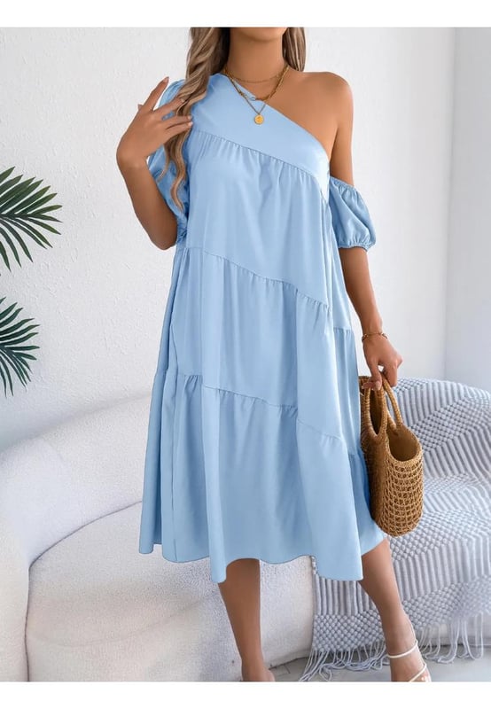 Asymmetrical design
  Tiered structure
  No stretch
  Body not lined
  Material composition: 95% polyester 5% elastane
  Care instructions: Machine wash cold tumble dry low
  Imported