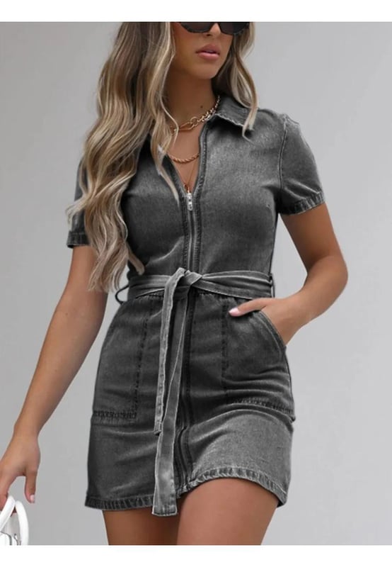 Full size zip front short sleeve denim dress
  Slightly stretchy material for added comfort
  Material composition: 90% viscose 10% polyester
  Features tied detail and pockets
  Care instructions: Machine wash cold tumble dry low
  Imported