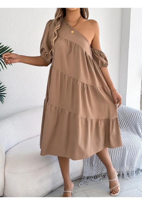 Asymmetrical design
  Tiered structure
  No stretch
  Body not lined
  Material composition: 95% polyester 5% elastane
  Care instructions: Machine wash cold tumble dry low
  Imported
