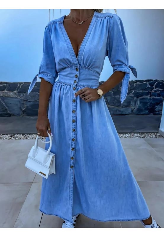 Button Front V
  Neck Half Sleeve Denim Dress
  65% cotton 35% polyester
  Buttoned front
  Tied waist
  No stretch
  Machine wash cold tumble dry low
  Imported
  Length: 49.6 inches (Small) 50 inches (Medium) 50.4 inches (Large) 50.8 inches (X
  Large)
  Shoulder: 14.6 inches (Small) 15 inches (Medium) 15.4 inches (Large) 15.7 inches (X
  Large)
  Bust: 33.9 inches (Small) 35.4 inches (Medium) 37.8 inches (Large) 40.2 inches (X
  Large)
  Sleeve Length: 12.2 inches (Small) 12.6 inches (Medium) 13 inches (Large) 13.4 inches (X
  Large)
  Waist: 27.6 inches (Small) 29.1 inches (Medium) 31.5 inches (Large) 33.9 inches (X
  Large)
Material: Denim