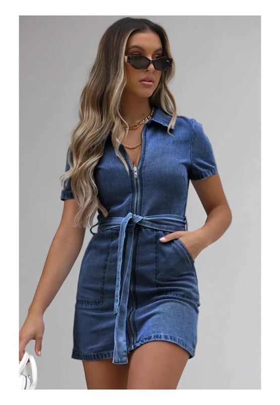 Full size zip front short sleeve denim dress
  Slightly stretchy material for added comfort
  Material composition: 90% viscose 10% polyester
  Features tied detail and pockets
  Care instructions: Machine wash cold tumble dry low
  Imported