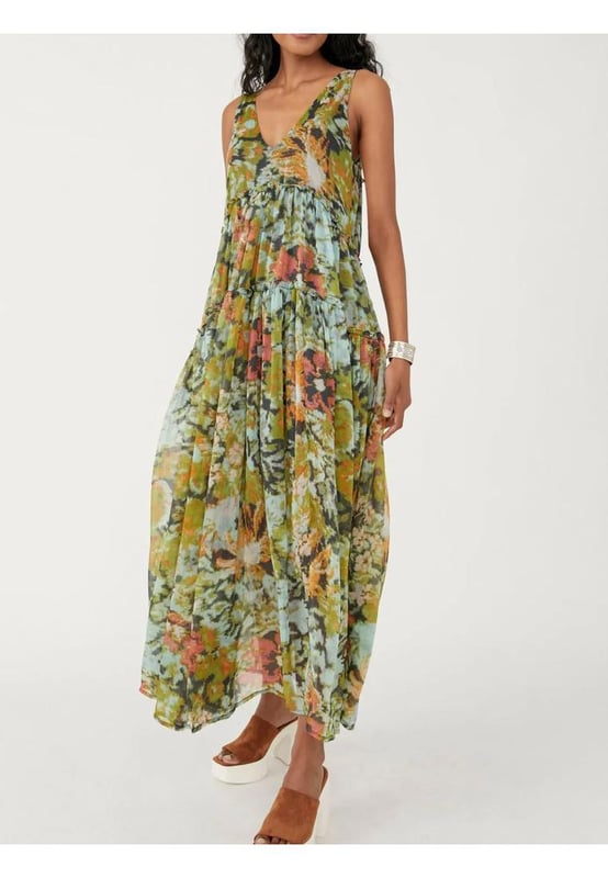 Printed V
  Neck Sleeveless Dress
  Features frill detailing
  No stretch
  Partially lined body
  Material composition: 65% polyester 35% cotton
  Care instructions: Machine wash cold tumble dry low
  Imported