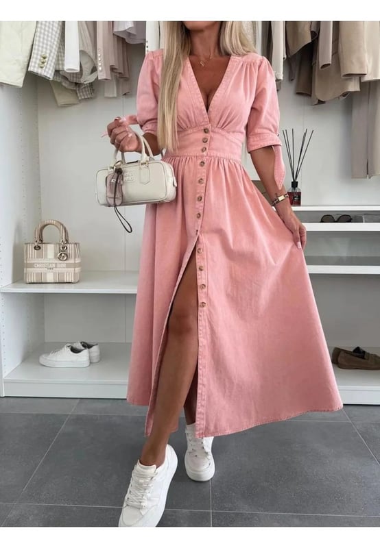 Button Front V
  Neck Half Sleeve Denim Dress
  65% cotton 35% polyester
  Buttoned front
  Tied waist
  No stretch
  Machine wash cold tumble dry low
  Imported
  Length: 49.6 inches (Small) 50 inches (Medium) 50.4 inches (Large) 50.8 inches (X
  Large)
  Shoulder: 14.6 inches (Small) 15 inches (Medium) 15.4 inches (Large) 15.7 inches (X
  Large)
  Bust: 33.9 inches (Small) 35.4 inches (Medium) 37.8 inches (Large) 40.2 inches (X
  Large)
  Sleeve Length: 12.2 inches (Small) 12.6 inches (Medium) 13 inches (Large) 13.4 inches (X
  Large)
  Waist: 27.6 inches (Small) 29.1 inches (Medium) 31.5 inches (Large) 33.9 inches (X
  Large)
Material: Denim