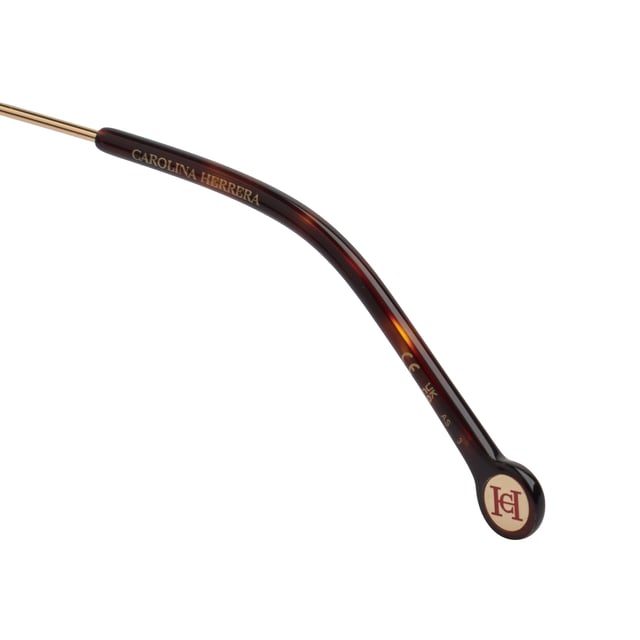 These Carolina Herrera sunglasses fuse elegant design with distinctive details that elevate any look with subtlety and sophistication.

 Shape and design:
 - These sunglasses feature a softly rounded square shape, providing visual balance and flattering a wide variety of faces.
 - The design is characterized by its enveloping structure and clean lines, which combine modernity with a timeless feel.

 Frame material:
 - The frame is made from a combination of acetate and metal, offering excellent durability with a refined finish.
 - Lightweight construction provides comfort even during extended use.

 Brand details:
 - Carolina Herrera logo inscription on temples.
 - Cylindrical metallic details with decorative stripes and the CH monogram provide visual identity and exclusivity to the design.

 Glasses:
 - Lenses with 100% UV protection filter, ideal for daily outdoor use.
 - Anti-reflective treatment that improves the visual experience and reduces glare.
 Measures: Lens width: 55 mm. Bridge: 20 mm. Temples: 145 mm
 Composition: Acetate, Metal
 Care:
Wash only with water or, if necessary, a mild soap.
 Dry with a soft cloth to avoid scratches.
 Avoid contact with harsh surfaces or abrasive liquids.