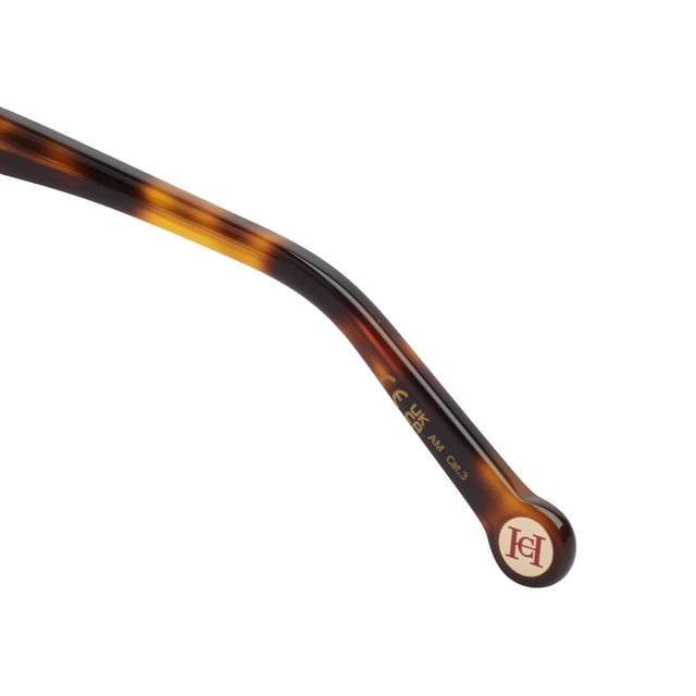 These Carolina Herrera sunglasses fuse elegant design with distinctive details that elevate any look with subtlety and sophistication. With a carefully crafted structure and refined finishes, they're the ideal accessory for those seeking style and protection with a distinct identity.

 Shape and design:
 - Soft cat-eye silhouette frame, ideal for enhancing features and adding a feminine touch with character.
 - Wraparound style that offers balanced visual coverage.

 Frame material:
 - High-quality acetate structure that provides strength and lightness.

 Brand details:
 - Carolina Herrera logo engraved on temples.
 - Rounded terminals with embossed CH metal logo, providing identity without excess.

 Glasses:
 - Lenses with 100% UV protection filter, ideal for daily outdoor use.
 Measures: Lens width: 53 mm. Bridge: 18 mm. Temples: 145 mm
 Composition: Acetate
 Care:
Wash only with water or, if necessary, a mild soap.
 Dry with a soft cloth to avoid scratches.
 Avoid contact with harsh surfaces or abrasive liquids.