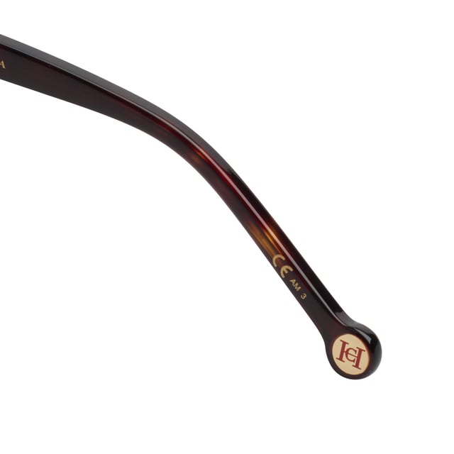 These Carolina Herrera sunglasses embody classic elegance reinterpreted with a contemporary approach. Their refined and understated design is designed for those who value sophistication in the smallest details, offering a timeless, feminine silhouette that blends harmoniously with a variety of styles.

 Shape and design:
 - Softened cat-eye silhouette, which delicately enhances the contours of the face.
 - Clean aesthetics with defined lines.

 Frame material:
 - High quality acetate structure.
 - Slim temples with decorative metal inserts provide an elegant contrast.

 Brand details:
 - CH initials precisely inlaid on the tips and metal details along the temples.

 Glasses:
 - 100% UV protection filter lenses provide safe sun coverage.
 - Anti-reflective coating for clearer, more comfortable vision under different lighting conditions.
 Measures: Lens width: 57 mm. Bridge: 20 mm. Temples: 145 mm
 Composition: Acetate
 Care:
Wash only with water or, if necessary, a mild soap.
 Dry with a soft cloth to avoid scratches.
 Avoid contact with harsh surfaces or abrasive liquids.