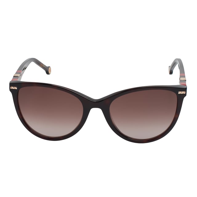 These Carolina Herrera sunglasses embody classic elegance reinterpreted with a contemporary approach. Their refined and understated design is designed for those who value sophistication in the smallest details, offering a timeless, feminine silhouette that blends harmoniously with a variety of styles.

 Shape and design:
 - Softened cat-eye silhouette, which delicately enhances the contours of the face.
 - Clean aesthetics with defined lines.

 Frame material:
 - High quality acetate structure.
 - Slim temples with decorative metal inserts provide an elegant contrast.

 Brand details:
 - CH initials precisely inlaid on the tips and metal details along the temples.

 Glasses:
 - 100% UV protection filter lenses provide safe sun coverage.
 - Anti-reflective coating for clearer, more comfortable vision under different lighting conditions.
 Measures: Lens width: 57 mm. Bridge: 20 mm. Temples: 145 mm
 Composition: Acetate
 Care:
Wash only with water or, if necessary, a mild soap.
 Dry with a soft cloth to avoid scratches.
 Avoid contact with harsh surfaces or abrasive liquids.