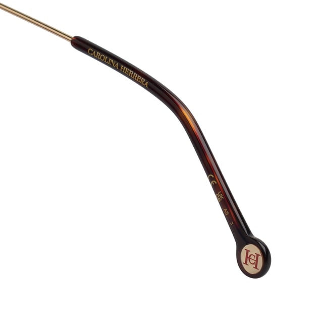 These Carolina Herrera sunglasses fuse contemporary design with timeless elegance in a softened square silhouette, ideal for elevating any style with ease and distinction.

 Shape and design:
 - Square silhouette with softly rounded edges.
 - Wrap-around design provides a comfortable and flattering fit.

 Frame material:
 - Combination of acetate on the front with ultra-light metal temples.
 - Acetate terminals that guarantee comfort and stability during prolonged use.

 Brand details:
 - Distinctive Carolina Herrera logo on temples.
 - Temples decorated with elegant enamelled metal rings.

 Glasses:
 - Lenses with 100% UV protection filter, ideal for safe sun exposure.
 Measures: Lens width: 56 mm. Bridge: 16 mm. Temples: 145 mm.
 Composition: Acetate
 Care:
Wash only with water or, if necessary, a mild soap.
 Dry with a soft cloth to avoid scratches.
 Avoid contact with harsh surfaces or abrasive liquids.