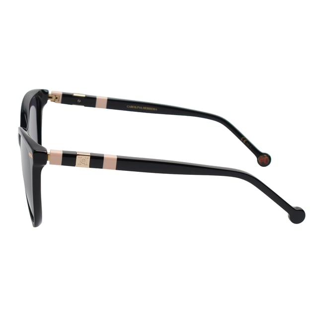 These Carolina Herrera sunglasses embody classic elegance reinterpreted with a contemporary approach. Their refined and understated design is designed for those who value sophistication in the smallest details, offering a timeless, feminine silhouette that blends harmoniously with a variety of styles.

 Shape and design:
 - Softened cat-eye silhouette, which delicately enhances the contours of the face.
 - Clean aesthetics with defined lines.

 Frame material:
 - High quality acetate structure.
 - Slim temples with decorative metal inserts provide an elegant contrast.

 Brand details:
 - CH initials precisely inlaid on the tips and metal details along the temples.

 Glasses:
 - 100% UV protection filter lenses provide safe sun coverage.
 - Anti-reflective coating for clearer, more comfortable vision under different lighting conditions.
 Measures: Lens width: 57 mm. Bridge: 20 mm. Temples: 145 mm
 Composition: Acetate
 Care:
Wash only with water or, if necessary, a mild soap.
 Dry with a soft cloth to avoid scratches.
 Avoid contact with harsh surfaces or abrasive liquids.
