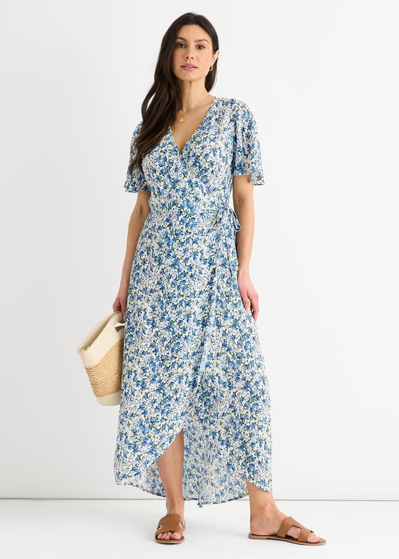 Eleva tu vestuario con nuestro vestido midi floral azul. Esta versátil prenda presenta un favorecedor diseño envolvente y un bonito estampado floral. Perfecto para cualquier evento informal, este vestido te permitirá pasar del día a la noche sin esfuerzo. Mejora tu estilo y siéntete segura allá donde vayas.