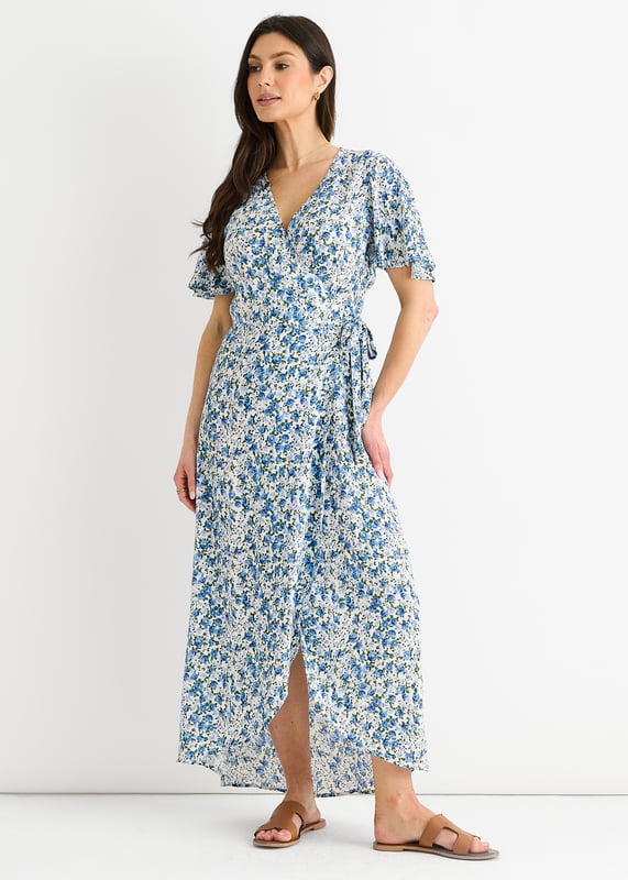 Eleva tu vestuario con nuestro vestido midi floral azul. Esta versátil prenda presenta un favorecedor diseño envolvente y un bonito estampado floral. Perfecto para cualquier evento informal, este vestido te permitirá pasar del día a la noche sin esfuerzo. Mejora tu estilo y siéntete segura allá donde vayas.
