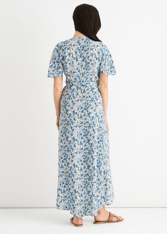Eleva tu vestuario con nuestro vestido midi floral azul. Esta versátil prenda presenta un favorecedor diseño envolvente y un bonito estampado floral. Perfecto para cualquier evento informal, este vestido te permitirá pasar del día a la noche sin esfuerzo. Mejora tu estilo y siéntete segura allá donde vayas.